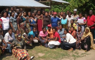 A group of people happily posing together for a photo.