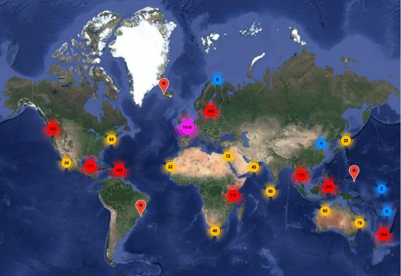 A world map with several heat spots around the world varying from blue to yellow to red to pink, with numbers in the middle. 