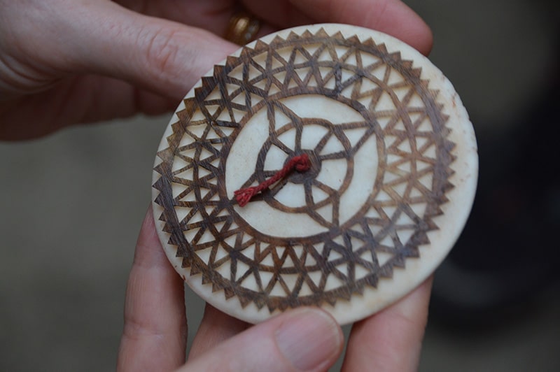 A compass-like object made of tortoiseshell.