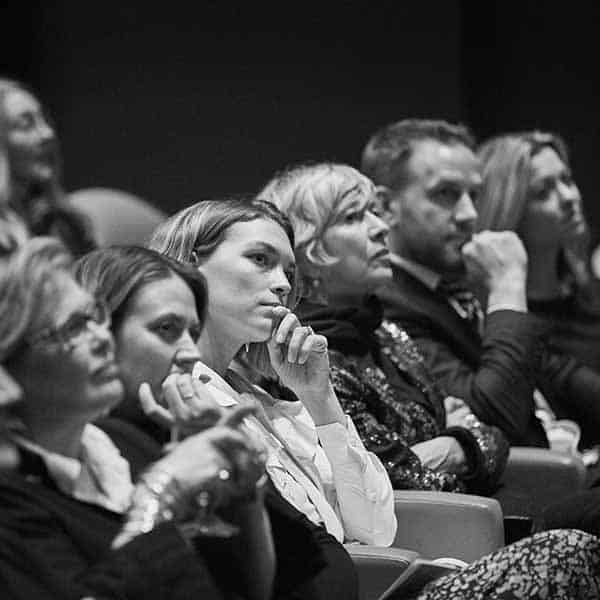 six people sitting in a presentation