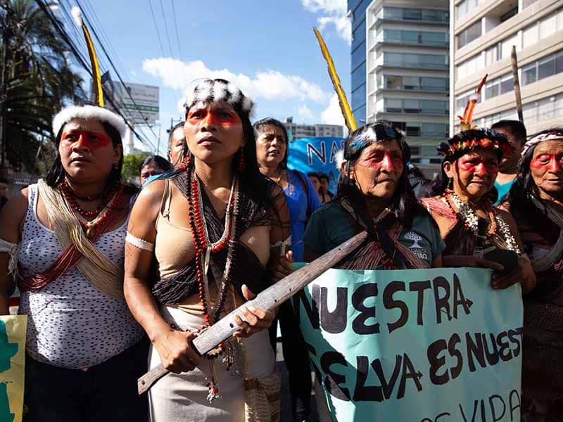 Waorani Indigenous leader Nemonte Nenquimo marches in Quito with other Indigenous leaders, in 2019