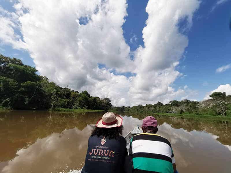Grace in a canoe with Instituto Juruá staff heading down the Juruá River