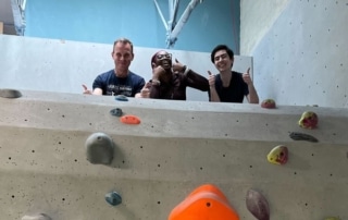 The communications team (Jim, Jessica and Claire) at a rock climbing social