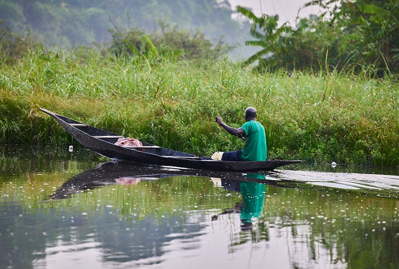 A local fisherman in a boat on the river. 