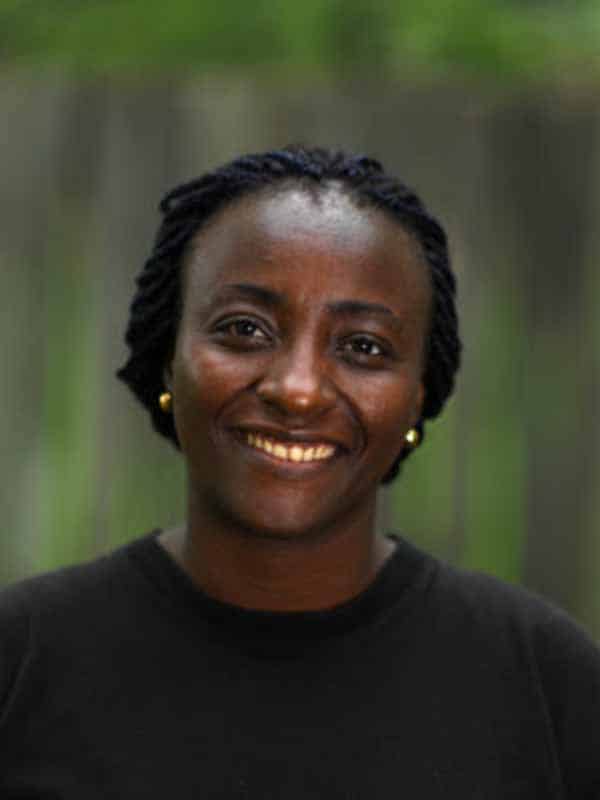 Head and shoulders photo of Marina Kameni against a green backdrop