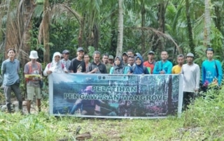 FORKANI team standing together holding a banner