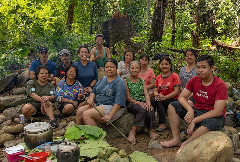 Diana with her family members, who are also part of TAKAD, alongside fellow TAKAD members in the forest