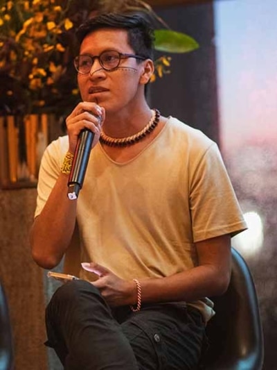 Alexis Grefa holding a microphone, speaks at the launch of the Chrysalis Youth Fund at New York Climate Week, 2023