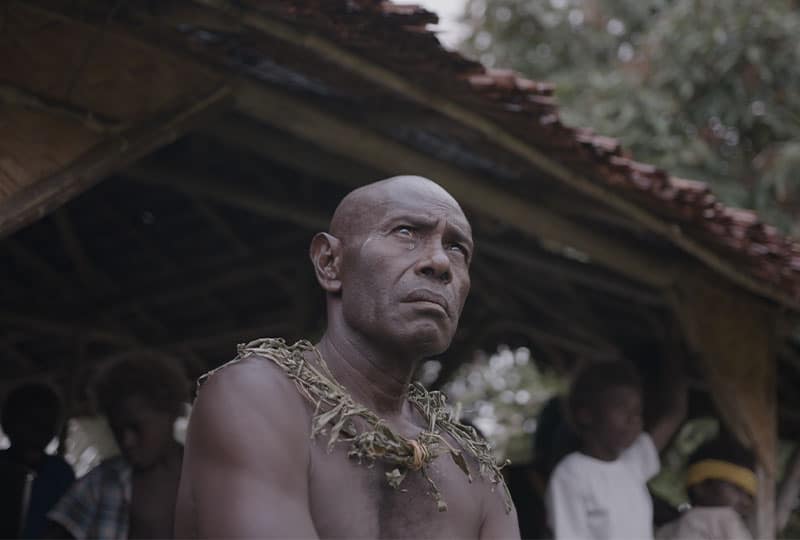 a man sat looking into the distance.