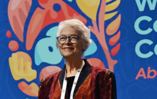 Kristina smiling on stage at Congress