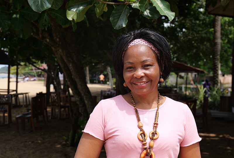 Four people talking at the IUCN World Conservation Congress 2025 in Abu Dhabi, with one woman smiling at the camera.