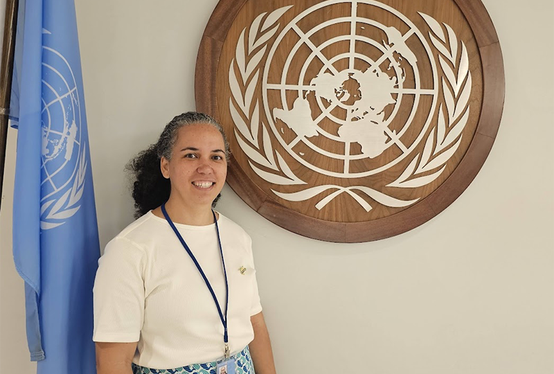 Kathryn Audroing from Trinidad and Tobago credit Ocean Voices Kristina Gjerde with her husband and son, smiling and posing for a photo at the Ocean Stewardship Award event