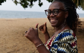 Mireille smiling on beach