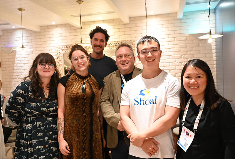 Image of a group of six people – the SHOAL team – standing together and smiling at the camera.